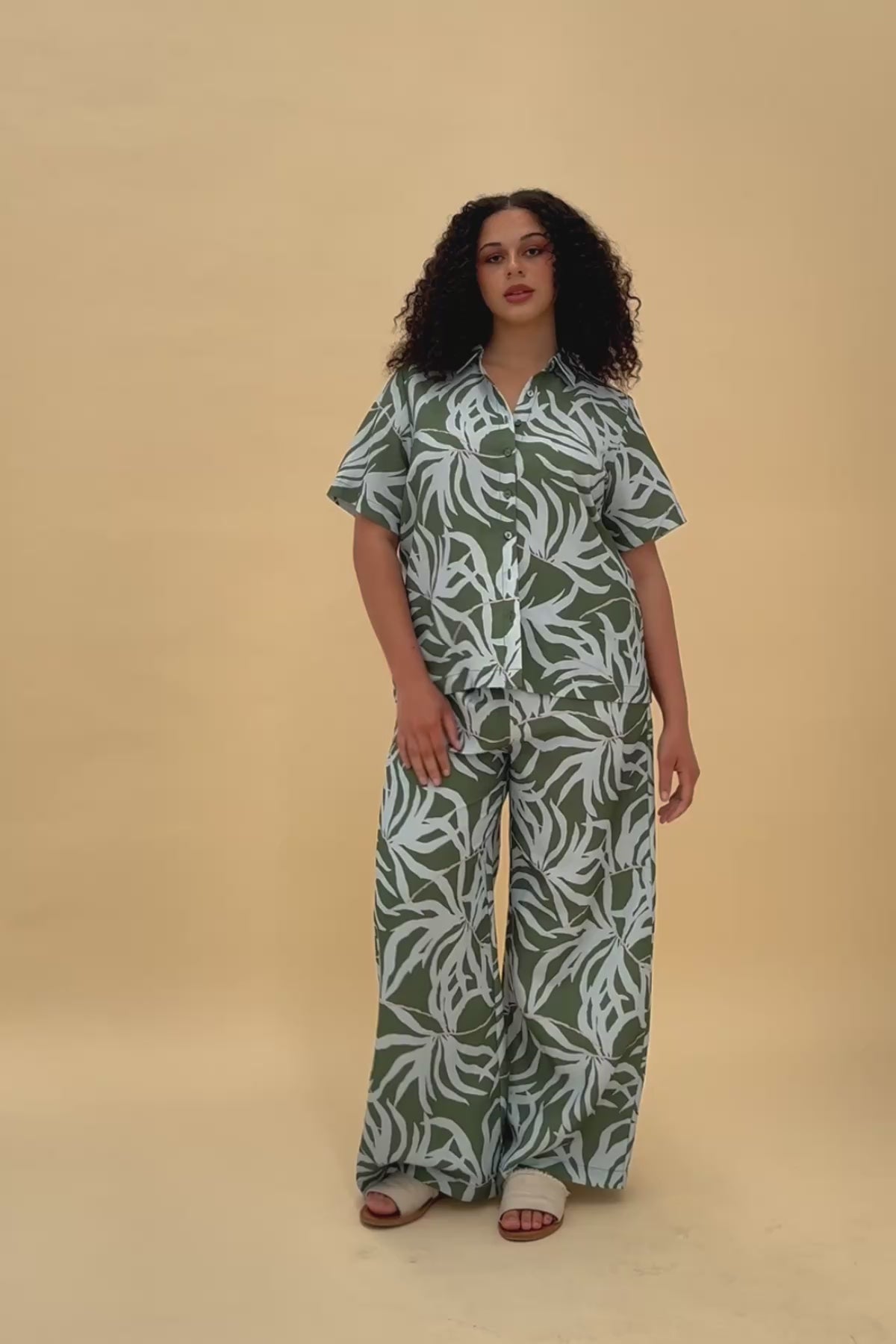 Woman wearing matching Frock Me Out Lets Be Fronds shirt and pants set 